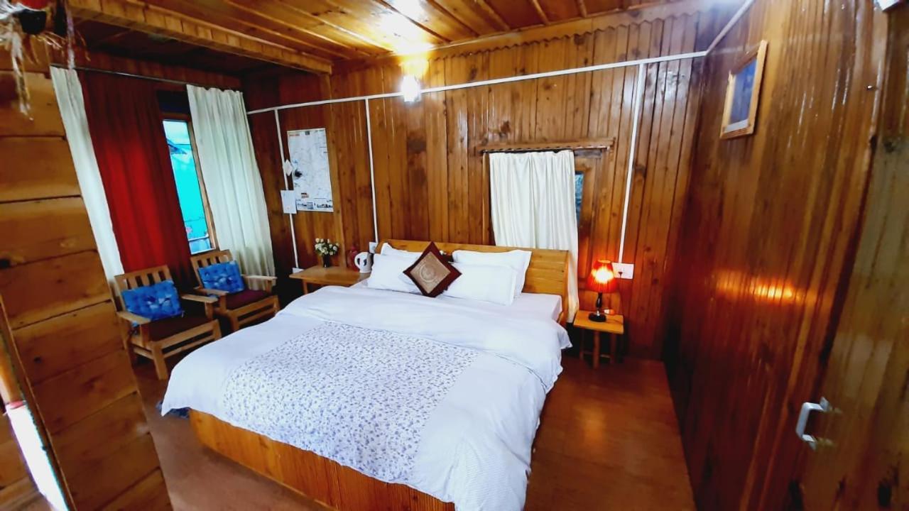 Ishan Log Huts-A Boutique Home Stay Banjar ภายนอก รูปภาพ