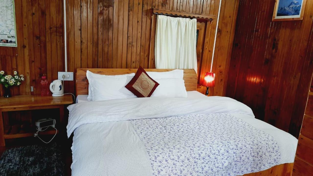 Ishan Log Huts-A Boutique Home Stay Banjar ภายนอก รูปภาพ