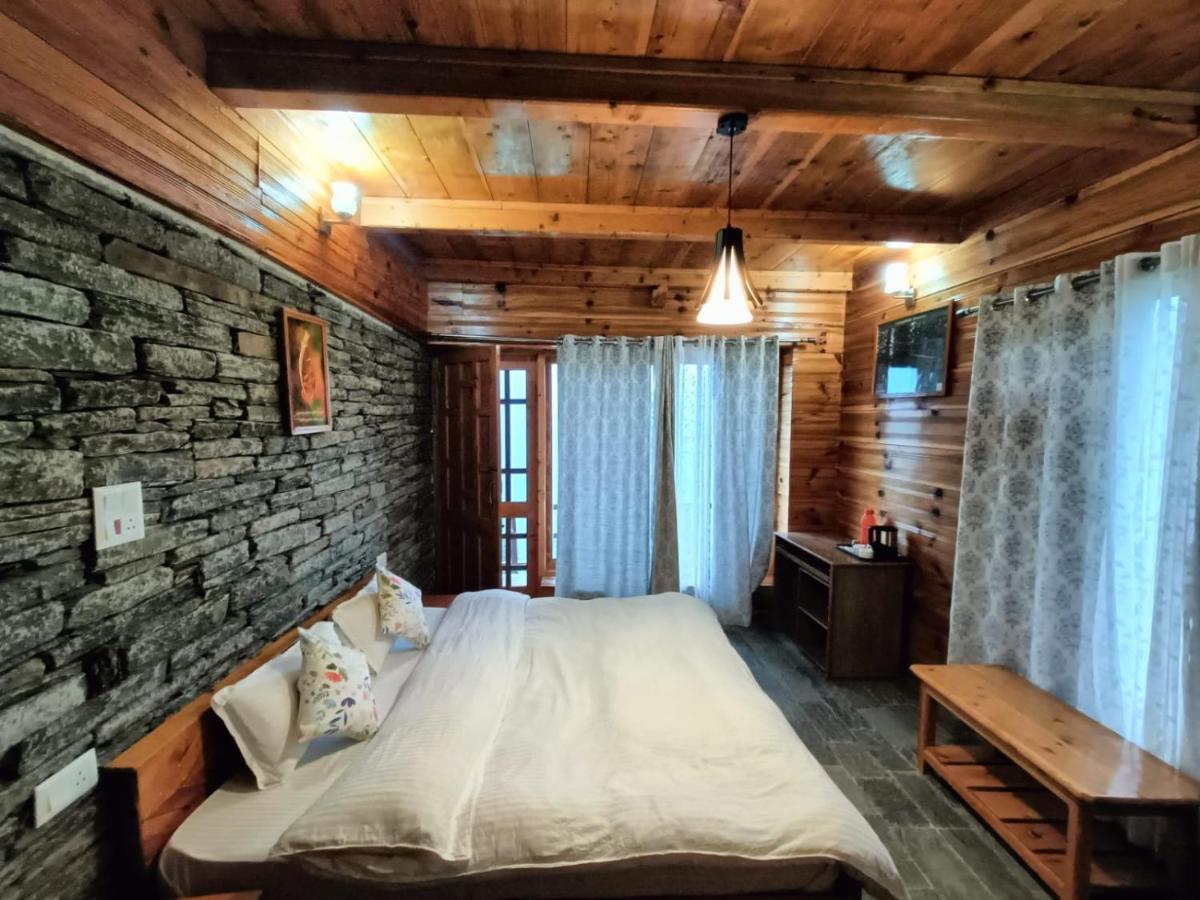 Ishan Log Huts-A Boutique Home Stay Banjar ภายนอก รูปภาพ